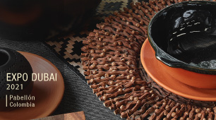 Foto ilustrativa de vajilla artesanal elaborada en cerámica color crudo y negro e individual elaborado en palma de seje.